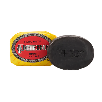 Black soap bar with a red and yellow packaging labeled 'Phebo' on a white background
