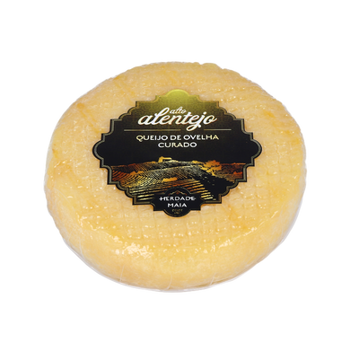 Round cheese with a label on a white background