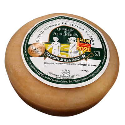 Round cheese with a label on a white background