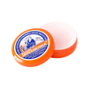An open jar of Mirancora hand cream, showing the bright orange container and the pale pink cream inside, with the branded lid resting in front on a plain white background.