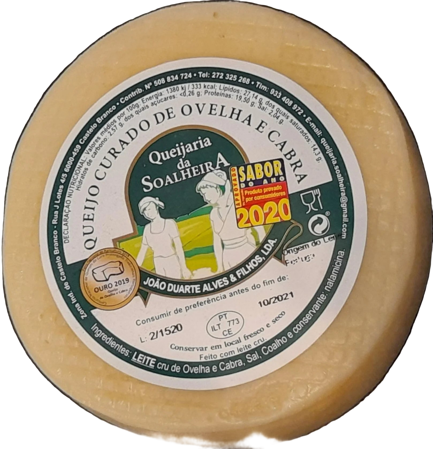 Round cheese with a label on a dark surface
