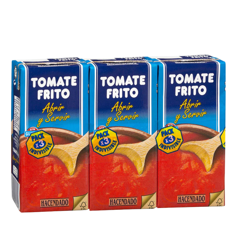 Three boxes of Tomate Frito with a wooden spoon illustration on a white background